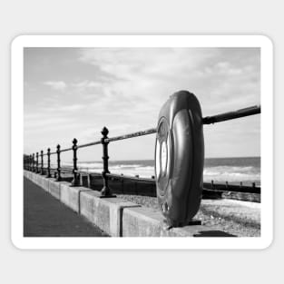 Life saver ring on the promenade at Cromer beach, Norfolk Sticker